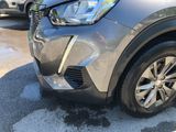 a close up of a car that is parked in a parking lot