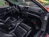 a red sports car with black leather seats and dashboard