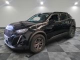 the black suv is parked on a checkered floor in the garage
