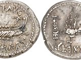 a silver coin with an image of a bird on it