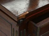 a wooden desk with a drawer on top of it