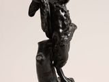 an image of a statue of a man holding a baseball bat