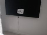 a flat screen tv mounted on the wall in the living room