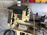 a machine that is sitting on a table in a garage