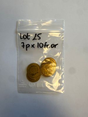deux pièces d'or dans un sachet en plastique muni d'une étiquette de prix