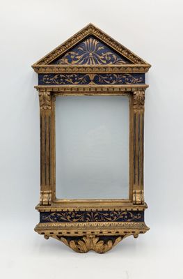 an ornate gold and blue mirror with a gold frame on a white wall