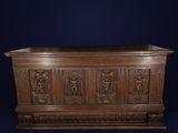 an old wooden chest with carvings and carvings on the sides