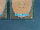 two cards with different designs on them on a table