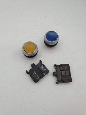 Trois boutons de couleurs différentes sont représentés sur une surface blanche