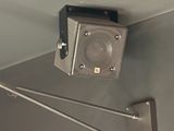 a speaker that is attached to the ceiling