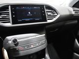 the interior of a car with a touch screen and a steering wheel