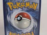a close up of a dvd case with a pokemon ball on it
