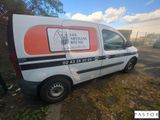 a van that is parked on the side of the road