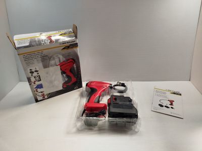 a red cordless drill and a black cordless drill on a table