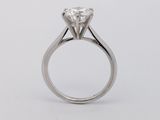 a close up of a diamond ring on a white background