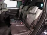 the interior of a car with two rows of seats in it
