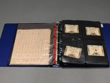 a blue folder with a lot of stamps inside of it