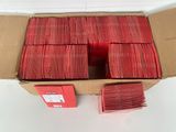 a box full of red cards sitting on a table