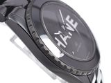 a close up of a watch on a white surface