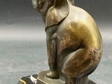 statue of an elephant on a pedestal with a black marble base