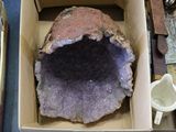 a box that has a large piece of rock inside of it