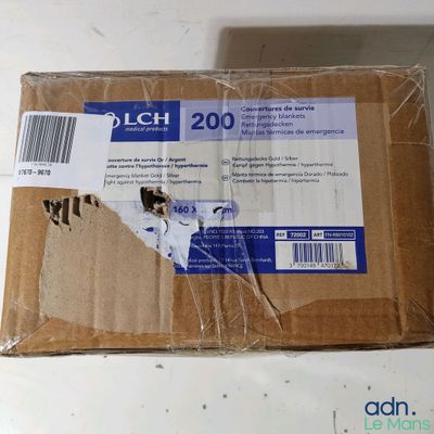 a cardboard box with a sticker on it on a table