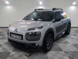 a silver car that is parked in a room