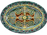 a picture of a green and red plate with a design on it