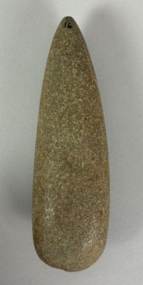 a stone vase that is sitting on a white surface