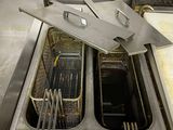 two deep fryers that are sitting inside of a machine