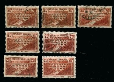 four different stamps with a picture of a bridge on them