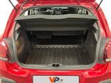 the back of a red car with its trunk open and the back of the car with its trunk open