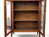 an image of a wooden cabinet with glass doors open