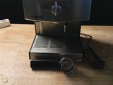 an image of a coffee machine on a wooden table