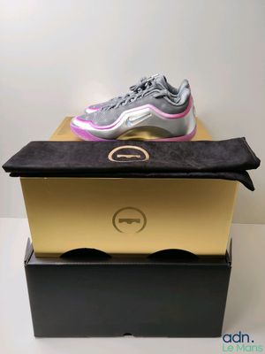 the nike air max 97 is on top of a box