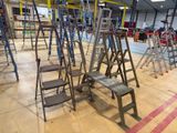 many ladders that are lined up in a room