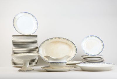 a lot of plates and cups on the table