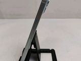 a cell phone that is sitting on top of a stand