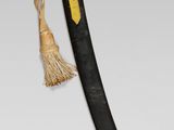 pair of swords with gold and black handles on a white background