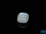 a white moons stone on a black surface