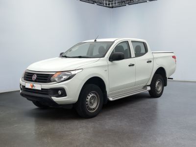 a picture of a white pick up truck parked in a garage