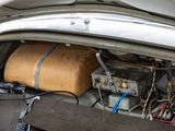 a car trunk with a bunch of electronics inside of it