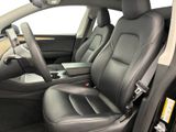 the interior of a car with black leather seats and a center console