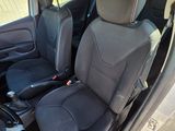 the interior of a car with two seats and a steering wheel