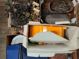 a pile of assorted items sitting on top of a carton