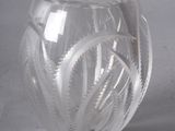 a clear glass vase with a spiral design on it