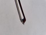 a pencil stuck in the middle of a piece of paper