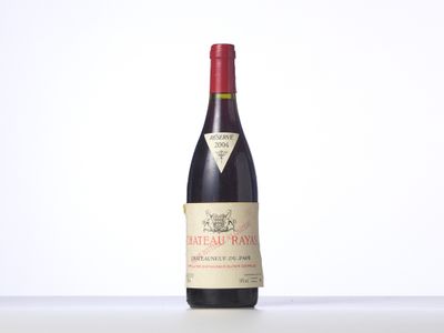 a bottle of red wine sitting on top of a table