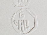 a close up of a white paper with a crown on it