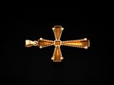 an image of a gold cross on a black background